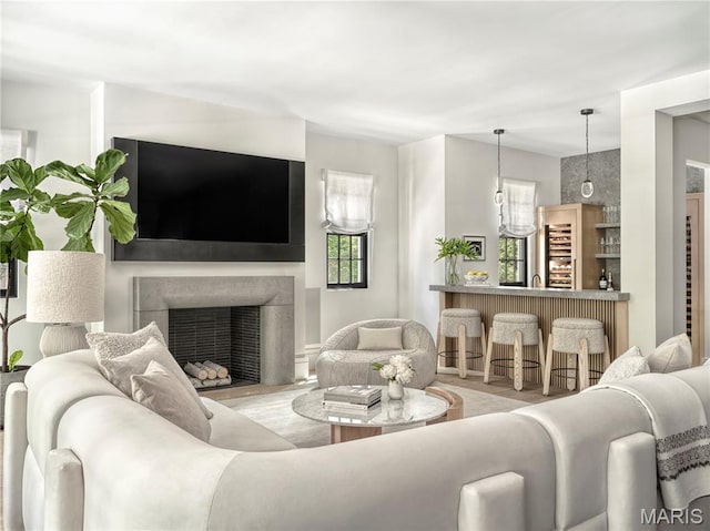 132 N Brentwood Blvd, Clayton, MO 63105 - living area featuring a fireplace with flush hearth and wood finished floors