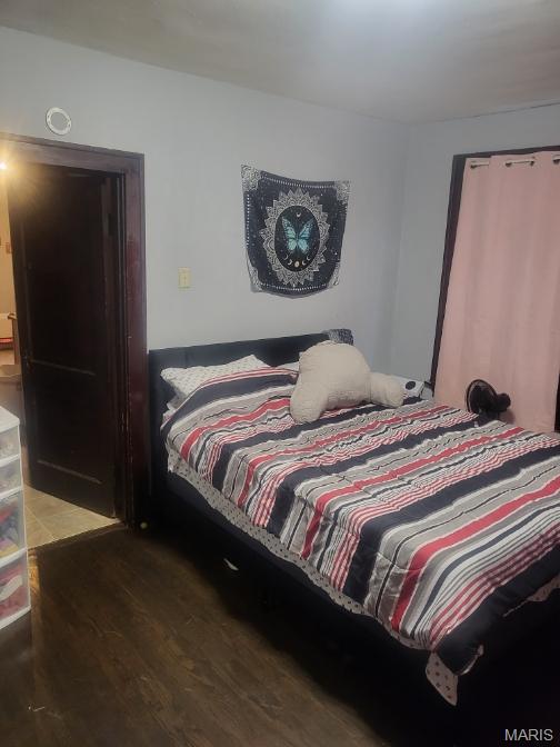 bedroom featuring wood finished floors