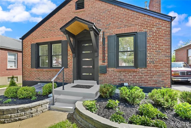 7544 Melrose Ave, University City, MO 63130 - entrance to property featuring brick siding and a chimney