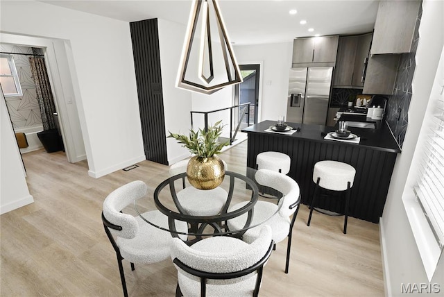 7544 Melrose Ave, University City, MO 63130 - dining area with light wood-style flooring, baseboards, and recessed lighting