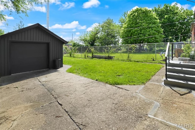 7544 Melrose Ave, University City, MO 63130 - view of yard with an outdoor structure, a detached garage, and driveway