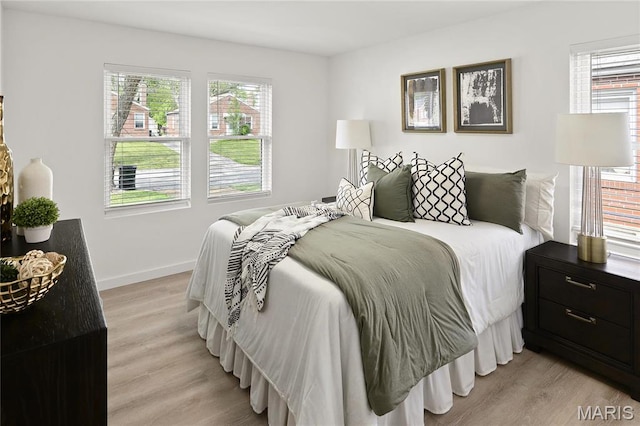 7544 Melrose Ave, University City, MO 63130 - bedroom featuring light wood-style flooring and baseboards