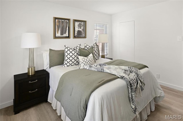 7544 Melrose Ave, University City, MO 63130 - bedroom featuring wood finished floors and baseboards