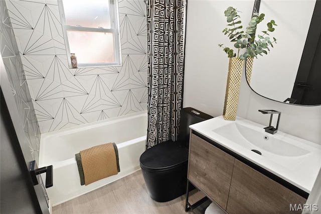 7544 Melrose Ave, University City, MO 63130 - full bathroom with toilet, shower / bathtub combination with curtain, vanity, and wood finished floors