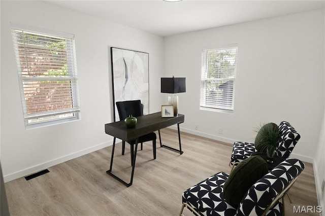 7544 Melrose Ave, University City, MO 63130 - home office featuring light wood finished floors and baseboards