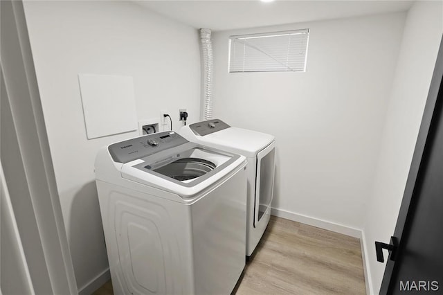 7544 Melrose Ave, University City, MO 63130 - laundry room with separate washer and dryer, light wood-style flooring, and baseboards