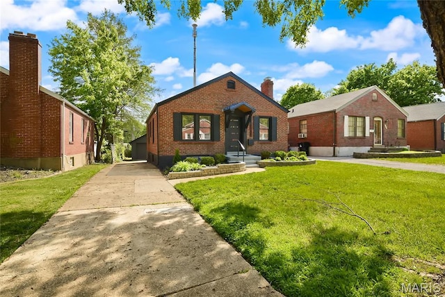 7544 Melrose Ave, University City, MO 63130 - bungalow-style home with brick siding, a front lawn, a chimney, and concrete driveway