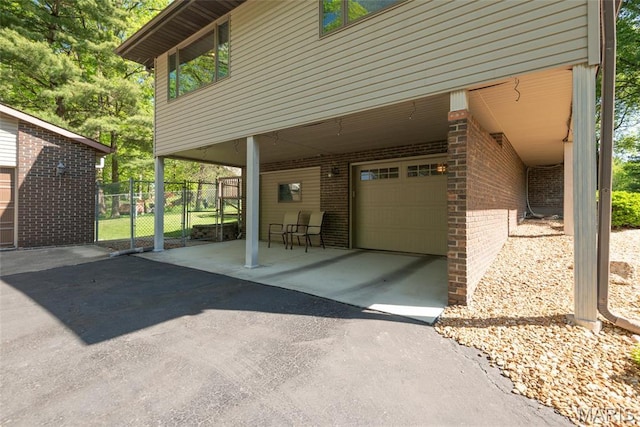 1934 Brigantine Cir, Worden, IL 62097 - view of patio with a carport, fence, asphalt driveway, and a gate