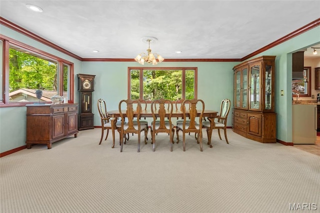 1934 Brigantine Cir, Worden, IL 62097 - dining room with plenty of natural light, baseboards, a chandelier, crown molding, and light colored carpet
