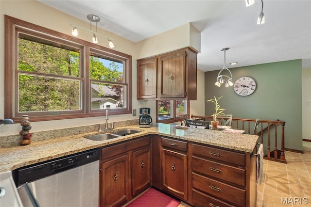 1934 Brigantine Cir, Worden, IL 62097 - kitchen with stainless steel dishwasher, a sink, a peninsula, light stone countertops, and decorative light fixtures