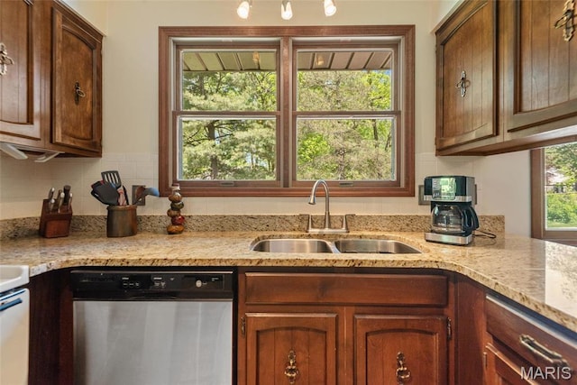 1934 Brigantine Cir, Worden, IL 62097 - kitchen with dishwasher, a sink, decorative backsplash, light stone countertops, and brown cabinets