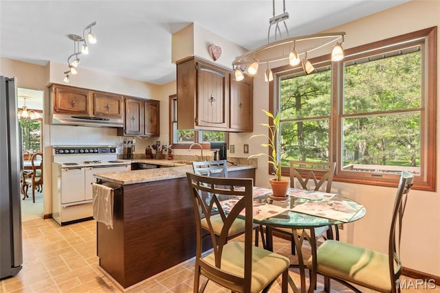 1934 Brigantine Cir, Worden, IL 62097 - kitchen featuring electric range, extractor fan, a sink, a peninsula, and freestanding refrigerator