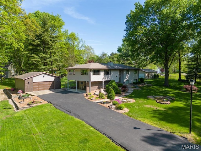 1934 Brigantine Cir, Worden, IL 62097 - view of front facade featuring an outdoor structure, a detached garage, and a front lawn