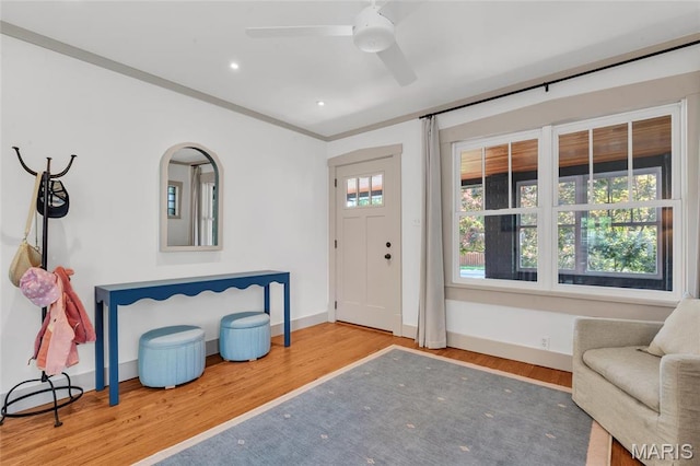 foyer entrance featuring wood finished floors, a ceiling fan, baseboards, and recessed lighting