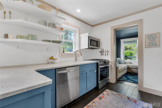 kitchen featuring open shelves, stainless steel appliances, blue cabinets, healthy amount of natural light, and recessed lighting