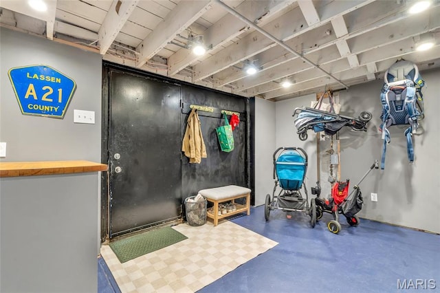 miscellaneous room featuring finished concrete flooring