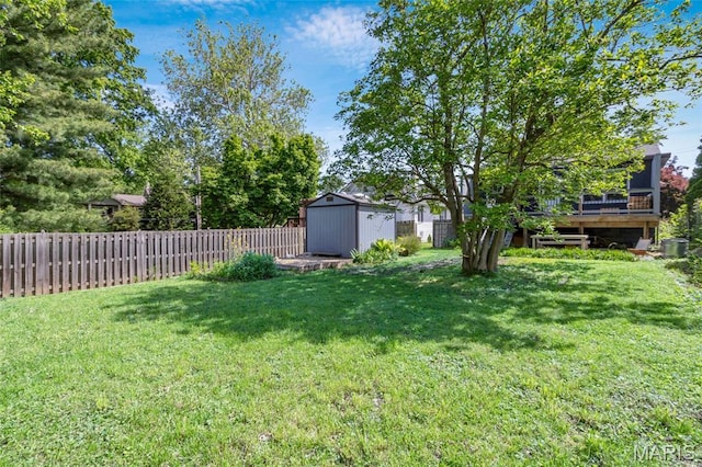 view of yard with a storage unit, an outdoor structure, and a deck
