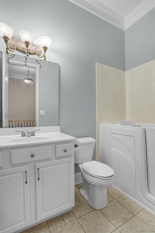bathroom with ornamental molding, toilet, tile patterned floors, and vanity