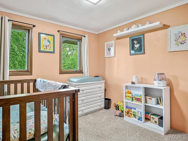 carpeted bedroom featuring crown molding