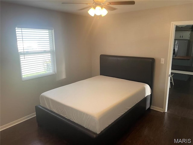 bedroom with baseboards, dark wood-style floors, and ceiling fan