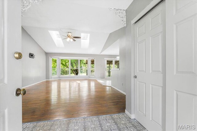 667 Workman Rd, Eureka, MO 63025 - unfurnished room with a skylight, vaulted ceiling, plenty of natural light, and baseboards
