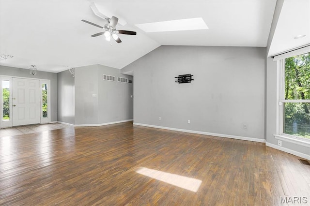 667 Workman Rd, Eureka, MO 63025 - unfurnished living room with a ceiling fan, wood-type flooring, baseboards, vaulted ceiling, and a skylight