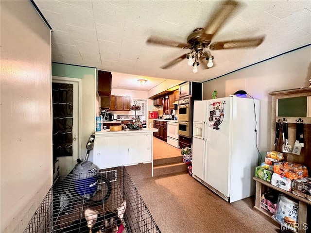kitchen with white appliances, a ceiling fan, light carpet, a peninsula, and light countertops
