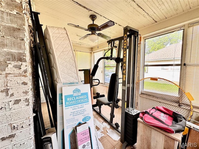 workout room with wood ceiling and ceiling fan