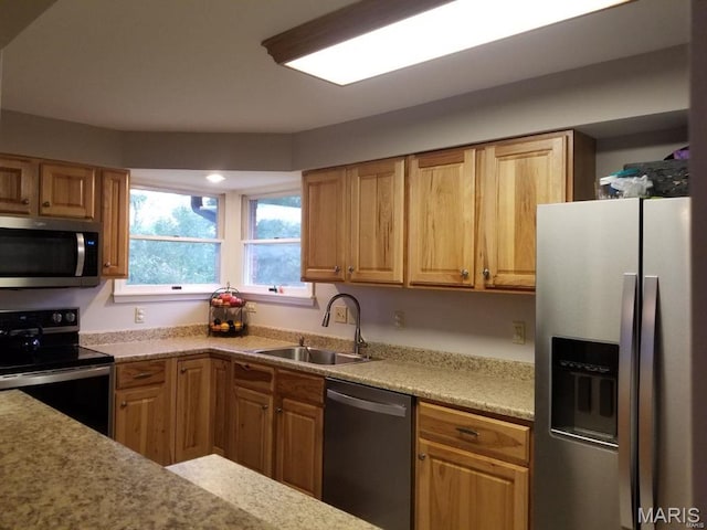 kitchen with stainless steel appliances and a sink