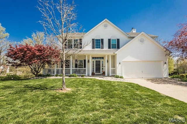 traditional-style house featuring driveway, a porch, a chimney, a front lawn, and a garage