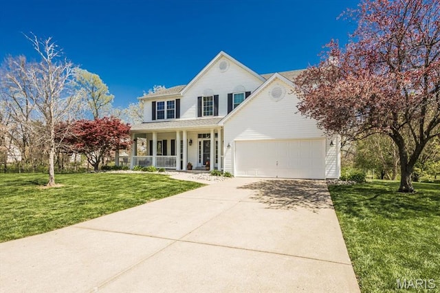 traditional home featuring a porch, concrete driveway, an attached garage, and a front yard