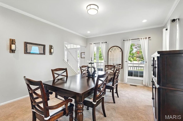 dining area featuring light carpet, stairs, crown molding, baseboards, and recessed lighting