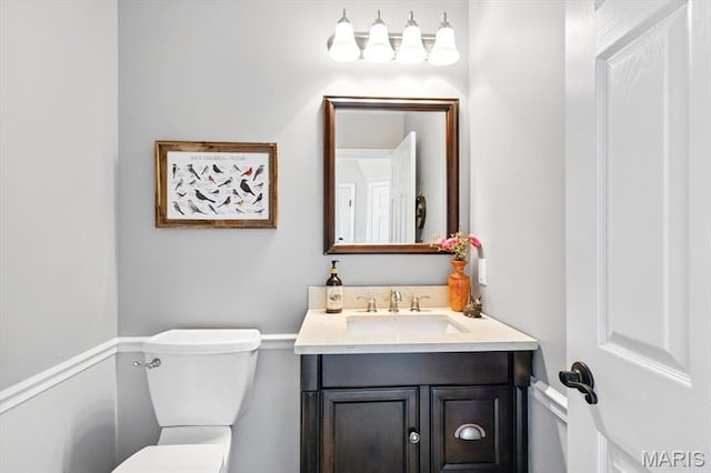 half bath with toilet and vanity