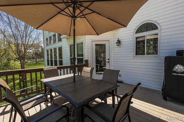 wooden deck with outdoor dining space