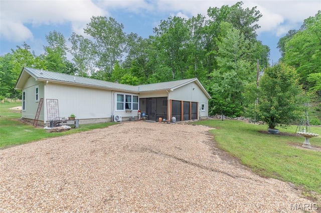 167 Ripley Co Rd Unit Y-3, Doniphan, MO 63935 - view of front of house featuring a sunroom, dirt driveway, a front yard, and metal roof