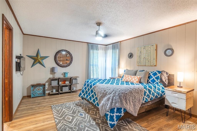 167 Ripley Co Rd Unit Y-3, Doniphan, MO 63935 - bedroom featuring crown molding, wood finished floors, a textured ceiling, and ceiling fan