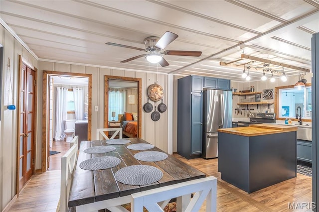 167 Ripley Co Rd Unit Y-3, Doniphan, MO 63935 - kitchen featuring wood counters, stainless steel appliances, light wood finished floors, ornamental molding, and a ceiling fan