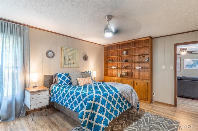 167 Ripley Co Rd Unit Y-3, Doniphan, MO 63935 - bedroom featuring wood finished floors, crown molding, baseboards, ceiling fan, and a textured ceiling