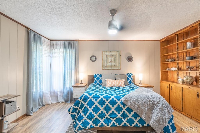 167 Ripley Co Rd Unit Y-3, Doniphan, MO 63935 - bedroom with light wood finished floors, crown molding, and a textured ceiling