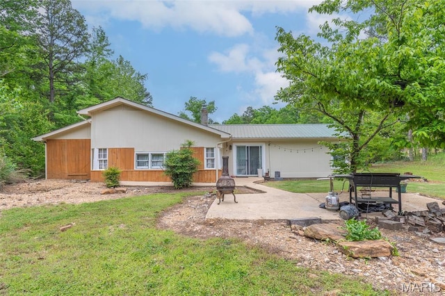 167 Ripley Co Rd Unit Y-3, Doniphan, MO 63935 - rear view of house featuring a patio area, metal roof, a lawn, and a chimney