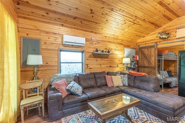 167 Ripley Co Rd Unit Y-3, Doniphan, MO 63935 - living room featuring a wall mounted air conditioner, lofted ceiling, a barn door, wood walls, and wood finished floors