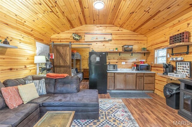 167 Ripley Co Rd Unit Y-3, Doniphan, MO 63935 - kitchen featuring freestanding refrigerator, vaulted ceiling, stainless steel microwave, wood ceiling, and open floor plan