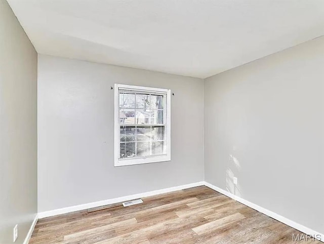 1749 Foley Dr, Saint Louis, MO 63136 - empty room with wood finished floors and baseboards