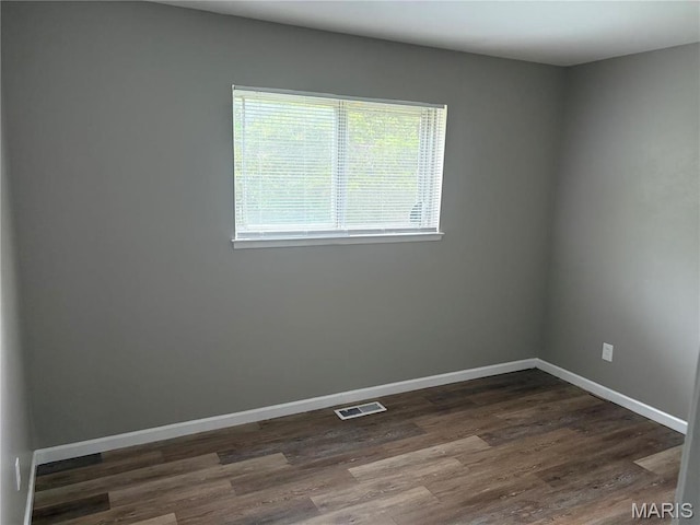 1749 Foley Dr, Saint Louis, MO 63136 - unfurnished room with dark wood-style floors and baseboards