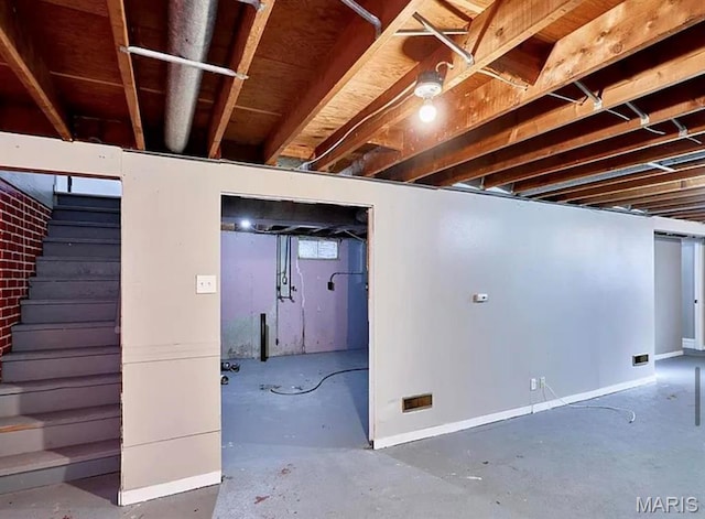 1749 Foley Dr, Saint Louis, MO 63136 - basement with baseboards and stairs