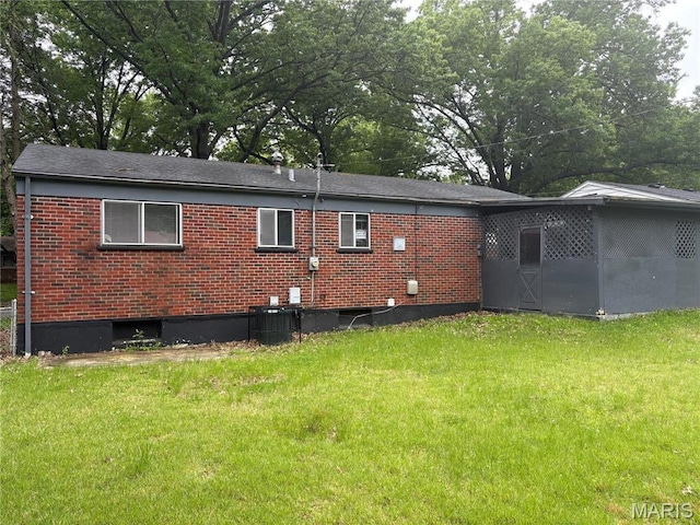1749 Foley Dr, Saint Louis, MO 63136 - rear view of property with brick siding and a yard