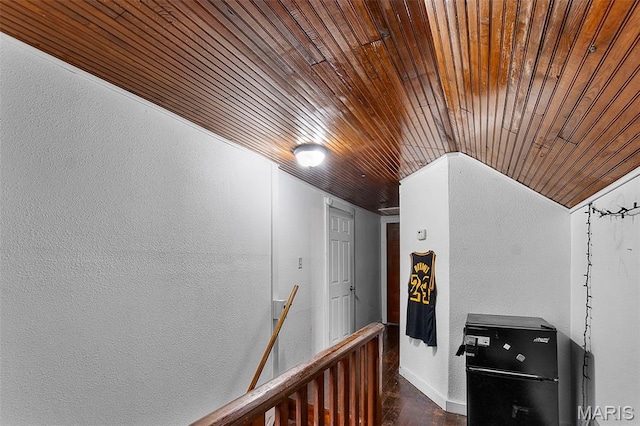 923 N Fountain St, Cape Girardeau, MO 63701 - corridor with wood ceiling, a textured wall, dark wood-type flooring, baseboards, and an upstairs landing