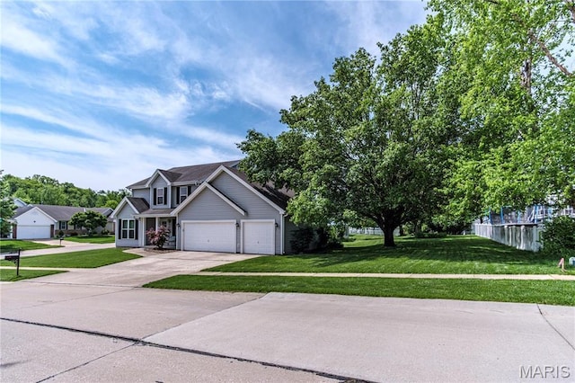 view of front of house featuring concrete driveway, a front lawn, and an attached garage