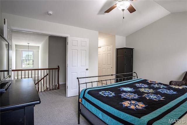 carpeted bedroom with lofted ceiling and ceiling fan