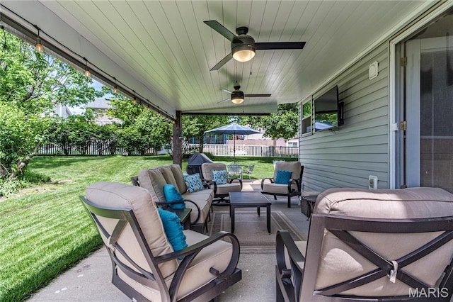 view of patio with an outdoor hangout area and ceiling fan